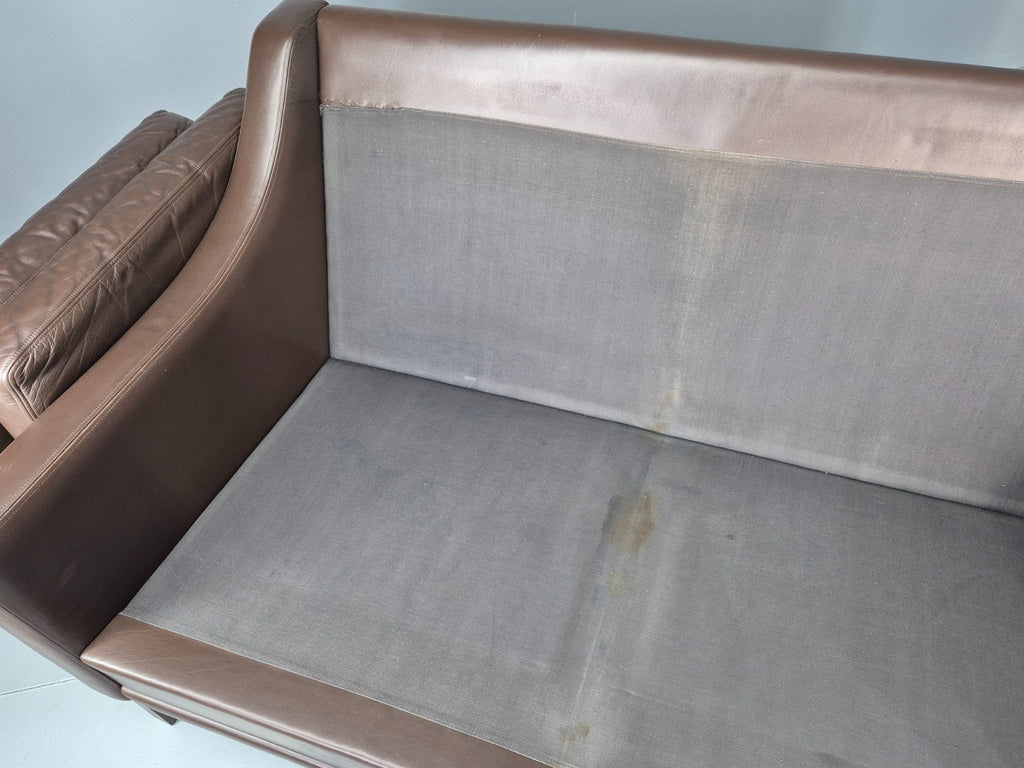 Brown leather sofa side profile view