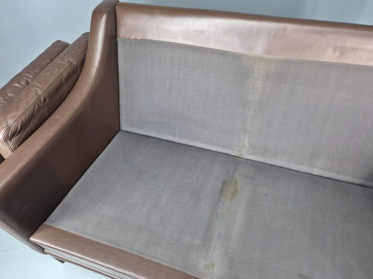 Brown leather sofa side profile view