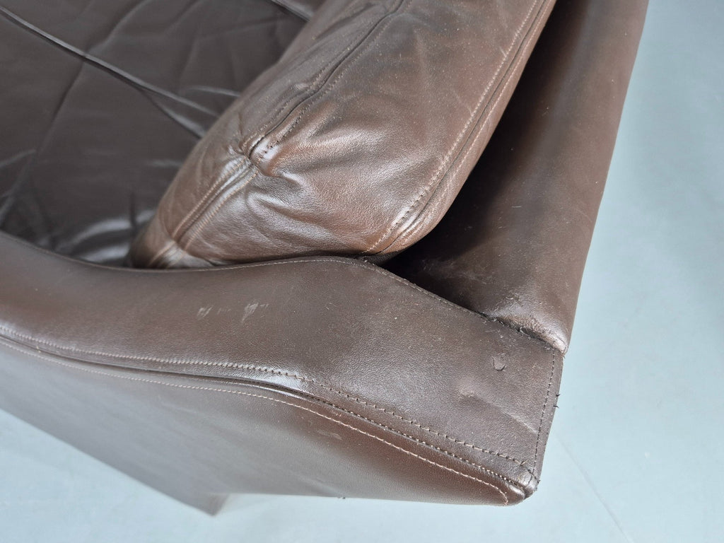 Brown leather sofa room context view