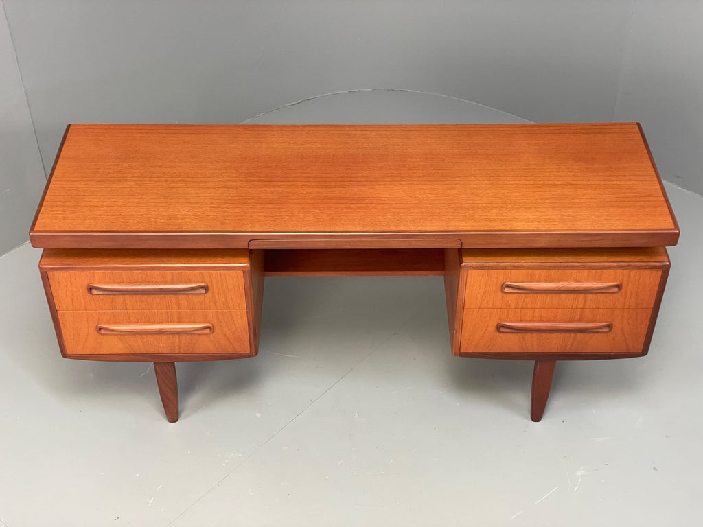 Teak dresser top surface honey tone grain detail