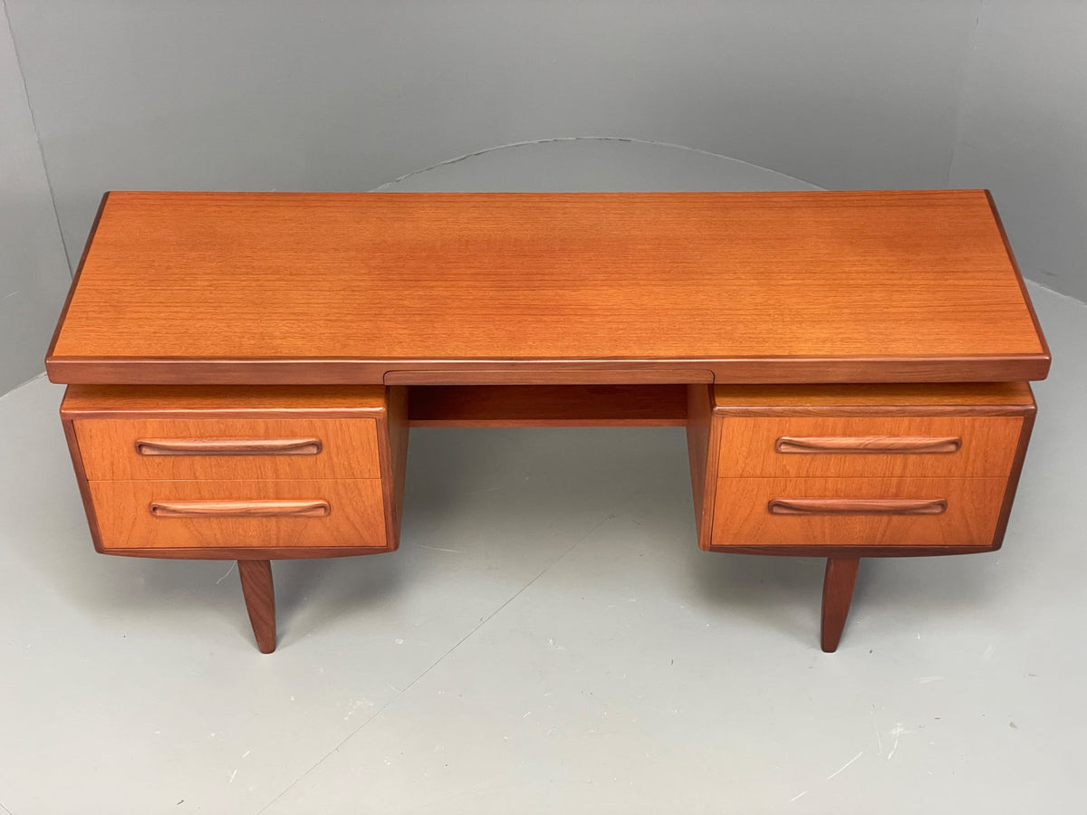 Teak dresser top surface honey tone grain detail