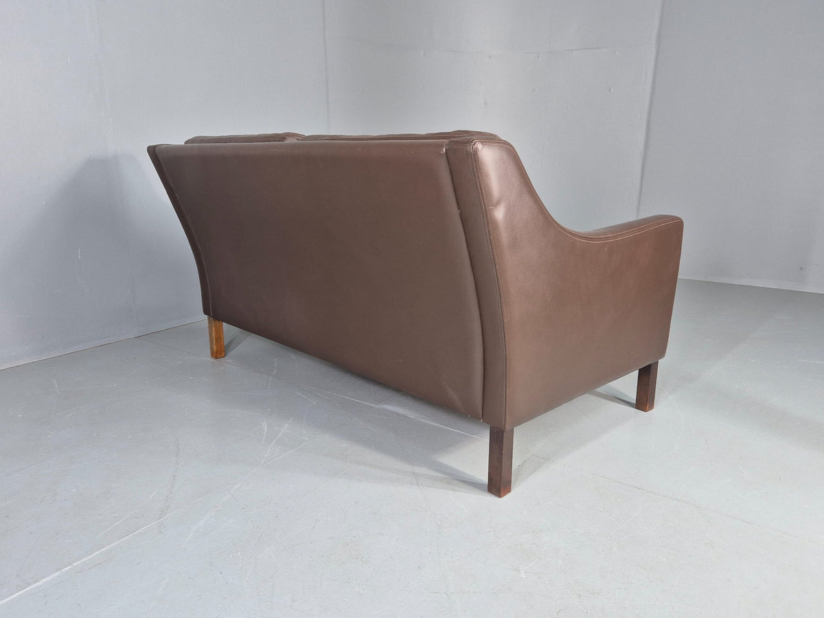 Brown leather sofa cushion shape retained
