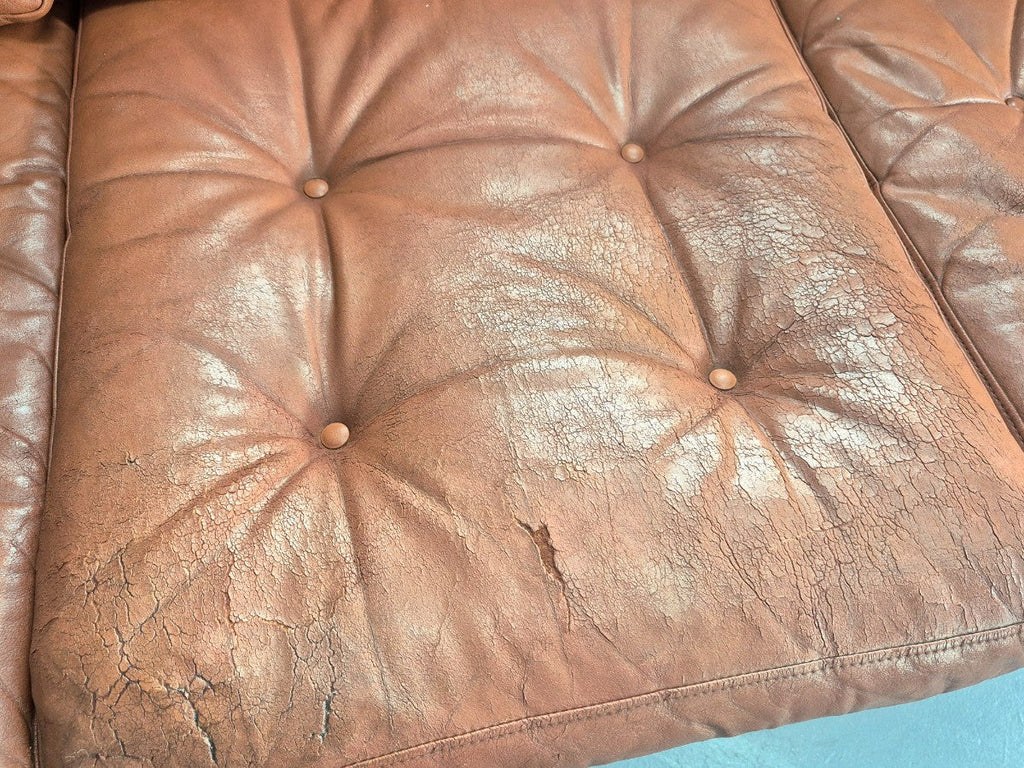 Tan leather sofa leg detail