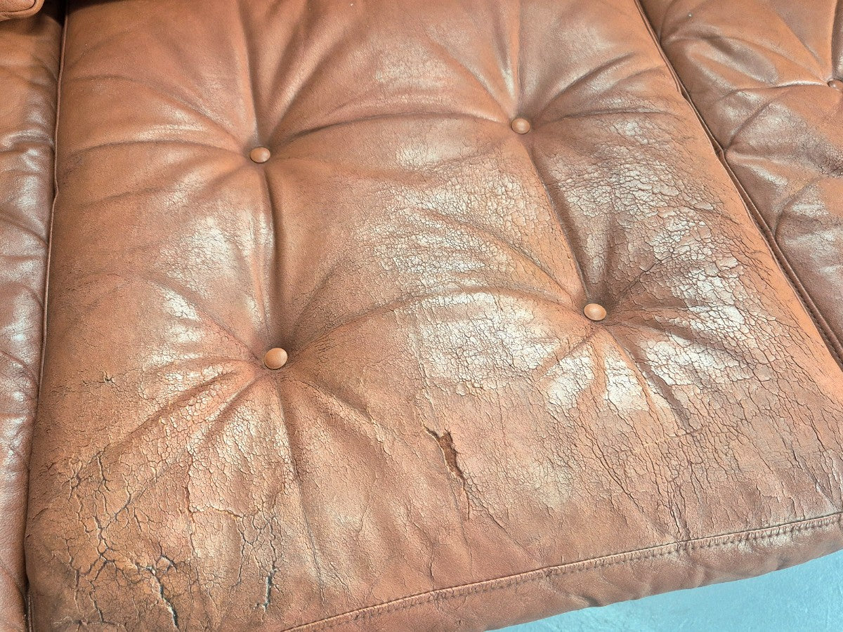 Tan leather sofa leg detail