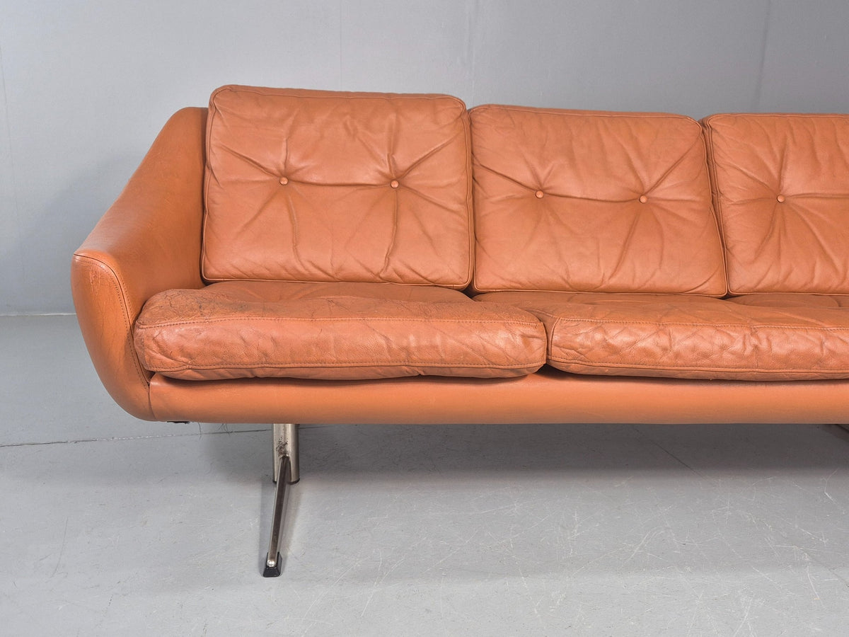 Tan leather sofa full front view amber undertone
