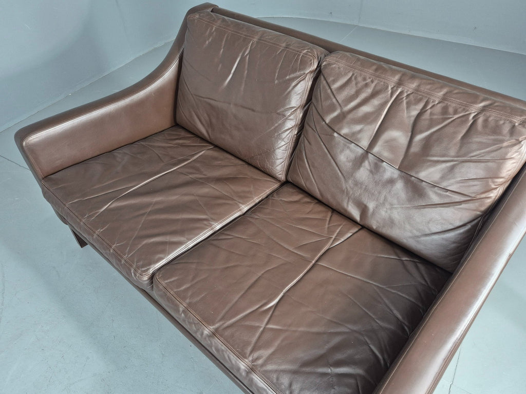 Brown leather sofa angled front view