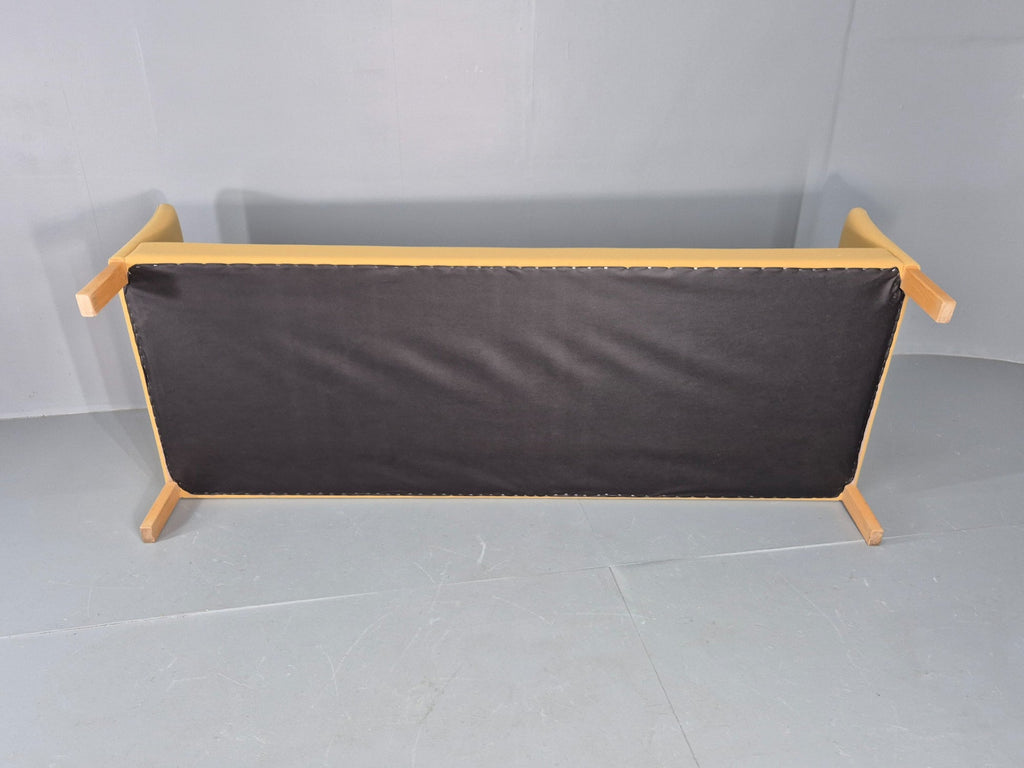 Yellow wool sofa side profile view