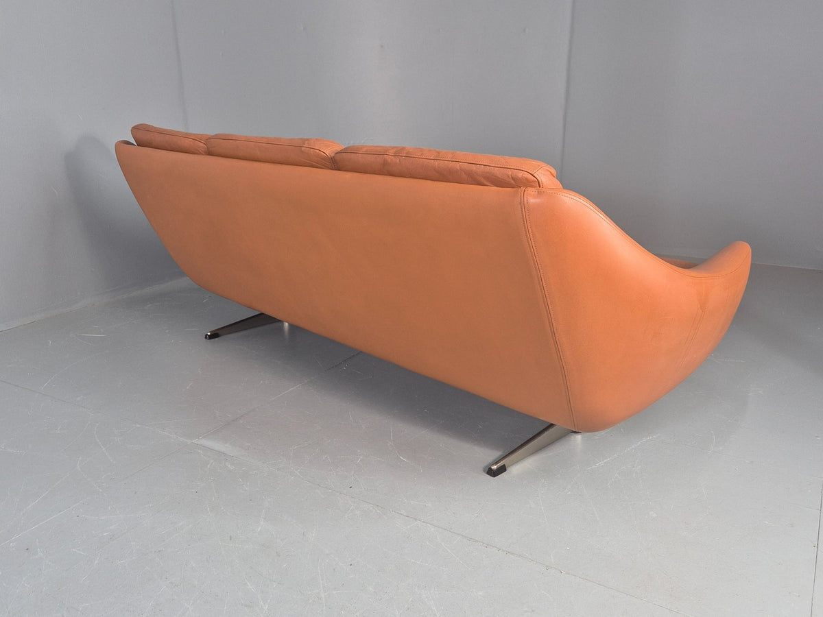 Tan leather sofa room context view
